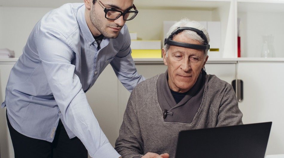 elderly person performing cognitive stimulation for brain training and memory improvement